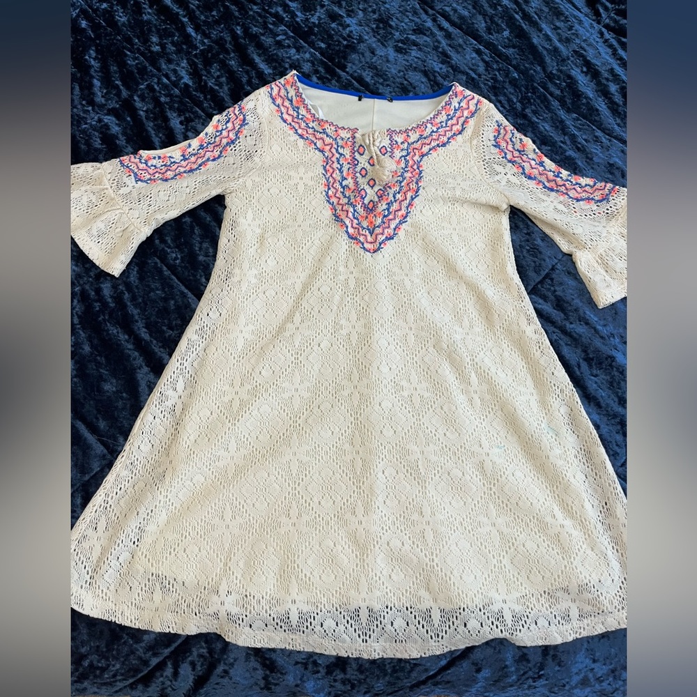 Pretty hippie chic- cottage-core style embroidered accents.